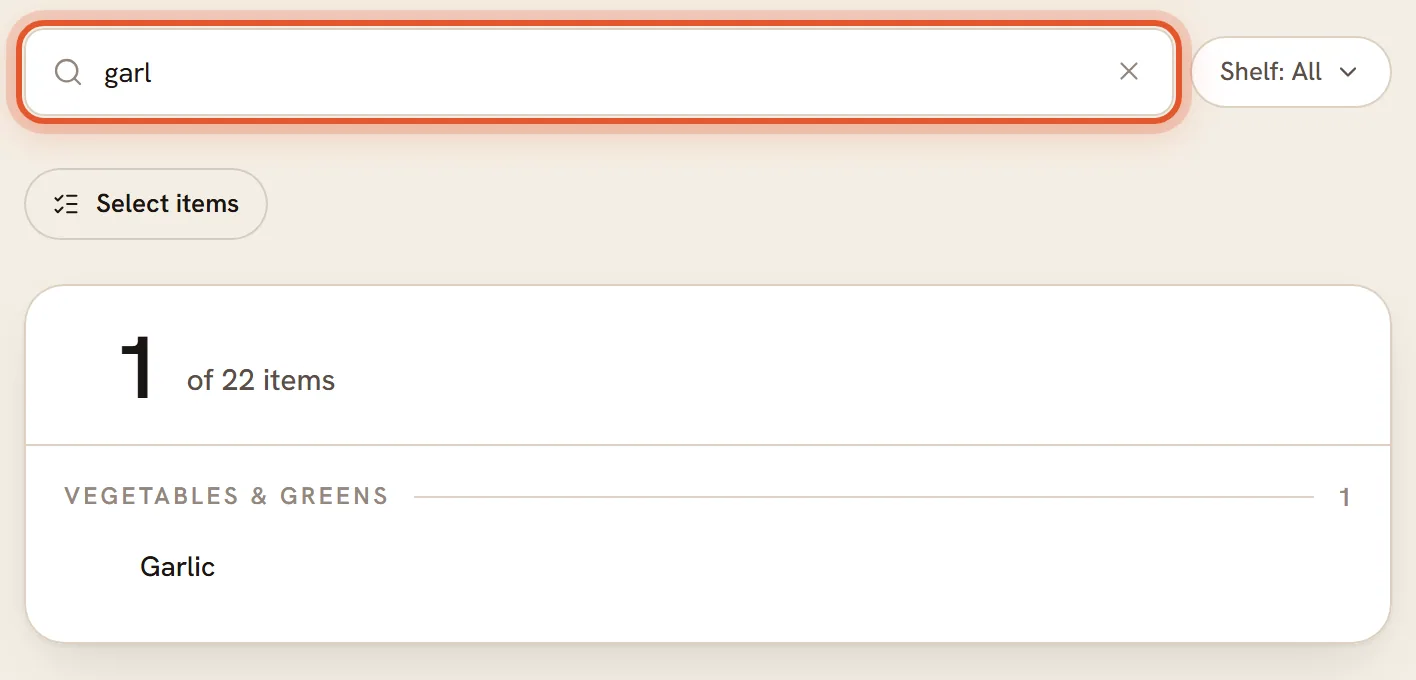 The Search pantry box with garl typed in, ringed. The heading says 1 of 22 items and Garlic is the only match.