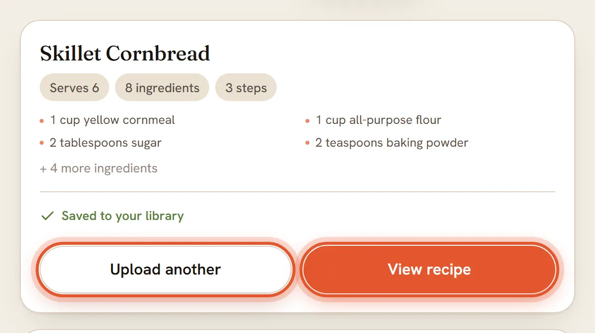 The finished Skillet Cornbread card with Saved to your library. Upload another and View recipe are ringed.